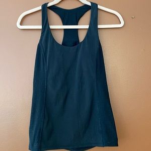 Trina Turk racer back style workout top in size small.  Built in cups.